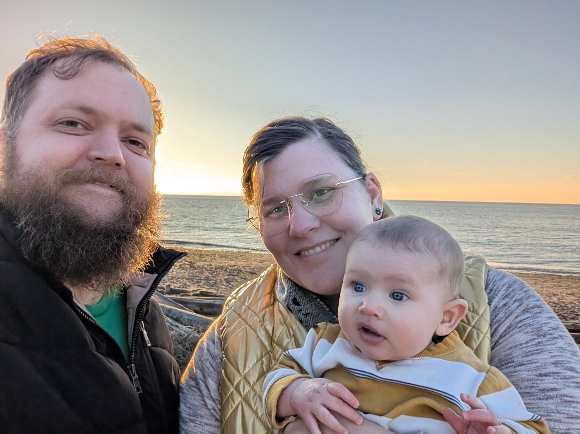 Duran Gradwell with his family on a beach at sunset